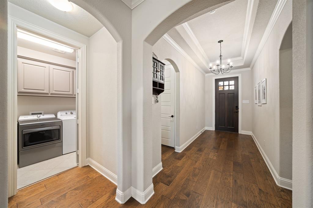 3601 Plainview Road Midlothian, TX 76065 - Photo 37 of 40 a view of a hallway view with wooden floor and a kitchen