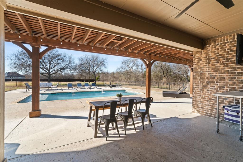 3601 Plainview Road Midlothian, TX 76065 - Photo 5 of 40 a view of a porch with furniture and a yard