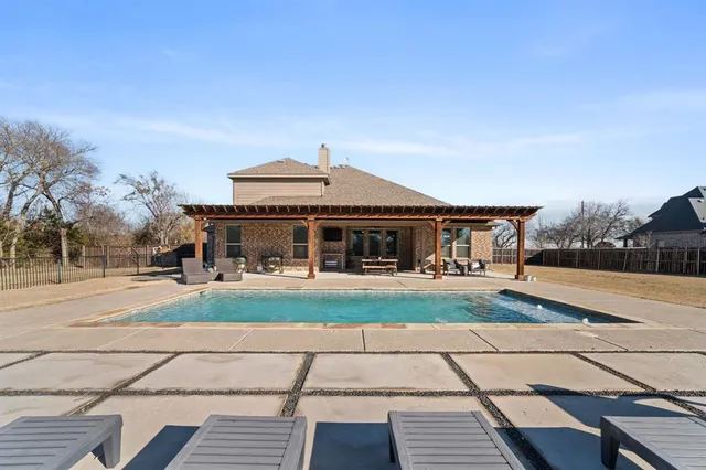 a view of a house with sitting area and roof
