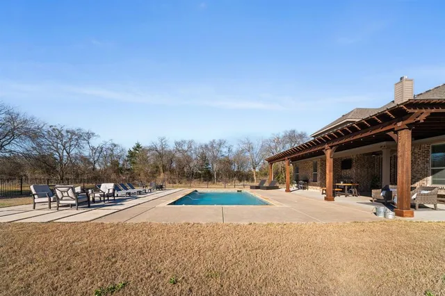 a living room with furniture fireplace and flat screen tv