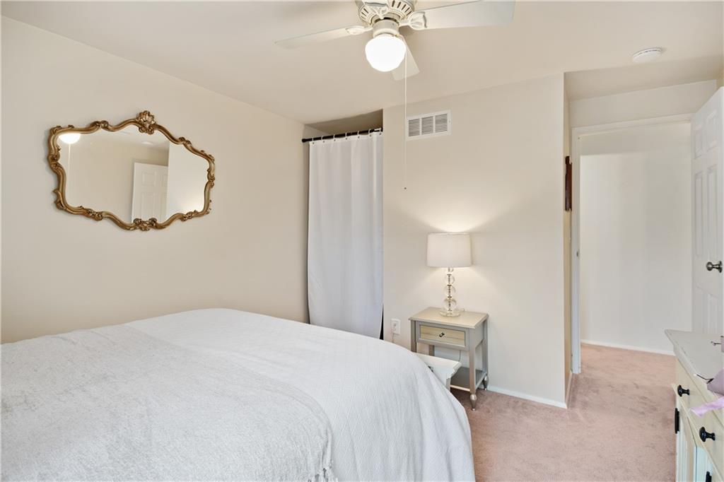 501 Cherry Court Pittsburgh, PA 15237 - Photo 16 of 25 a bedroom with a bed and a chandelier