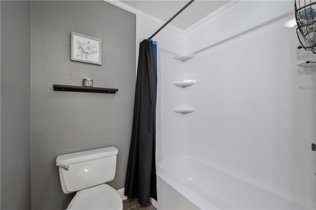 501 Cherry Court Pittsburgh, PA 15237 - Photo 19 of 25 a white toilet sitting next to a bath tub