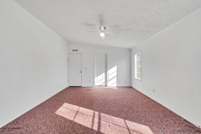 a spacious bathroom with a double vanity sink a mirror and a bathtub