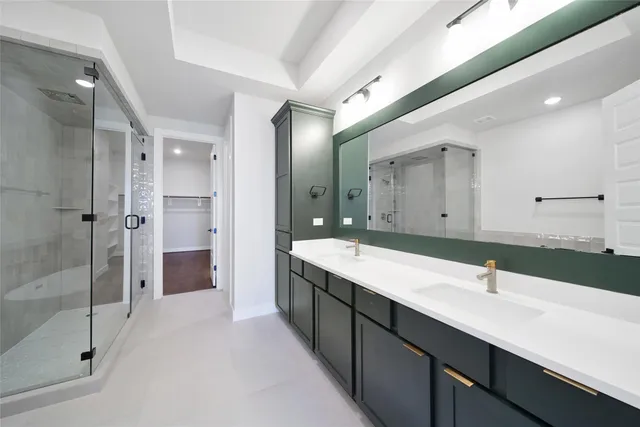 a bathroom with a double vanity sink and mirror