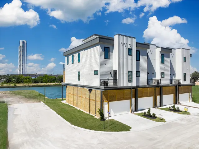 a view of a house with swimming pool and sitting area