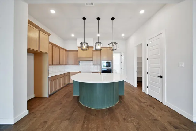 a large kitchen with a lot of counter space