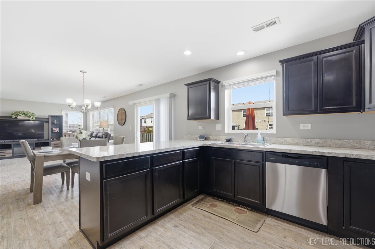 270 Norfolk Lane Pingree Grove, IL 60140 - Photo 11 of 25 a kitchen with a sink and cabinets