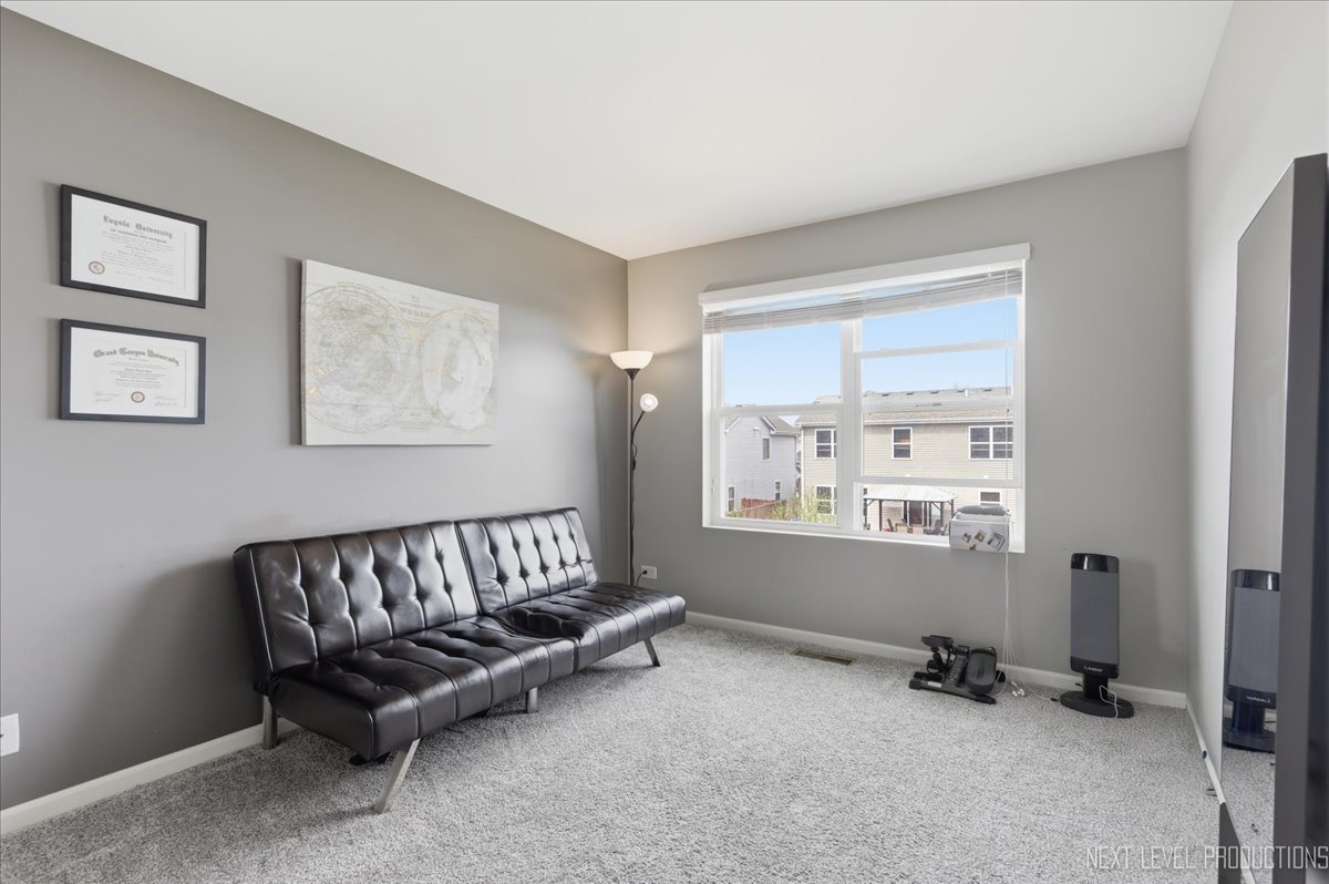 270 Norfolk Lane Pingree Grove, IL 60140 - Photo 14 of 25 a living room with furniture and a window
