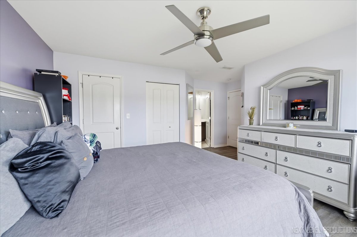 270 Norfolk Lane Pingree Grove, IL 60140 - Photo 17 of 25 a bedroom with a bed and a mirror on the dresser