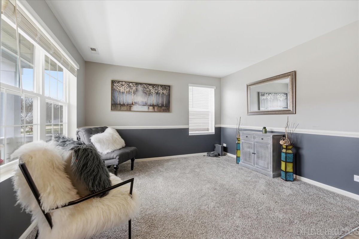 270 Norfolk Lane Pingree Grove, IL 60140 - Photo 4 of 25 a living room with furniture and a window