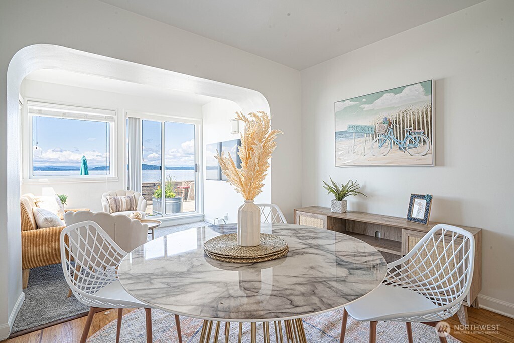 4027 Beach Drive Southwest, Unit 1 Seattle, WA 98116 - Photo 14 of 28 a dining room with furniture and a large window