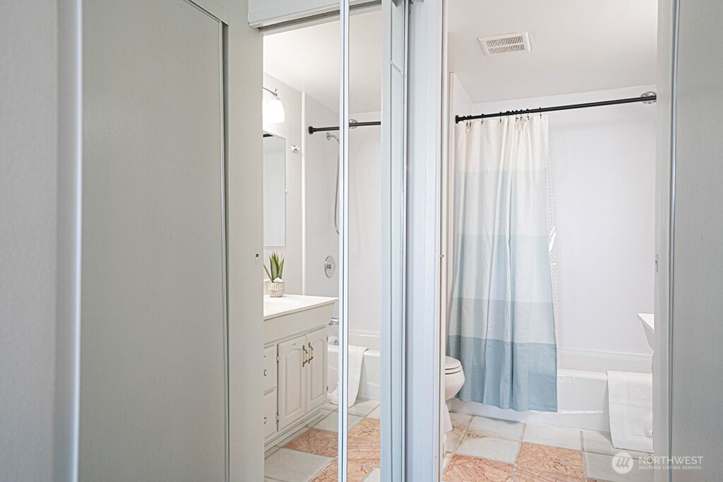 4027 Beach Drive Southwest, Unit 1 Seattle, WA 98116 - Photo 16 of 28 a bathroom with a shower