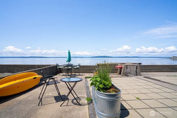 a view of a terrace with furniture and a potted plant