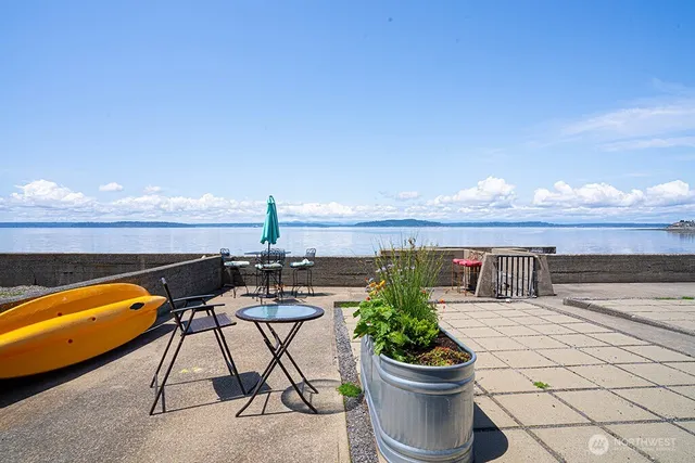 a view of a terrace with furniture and a potted plant
