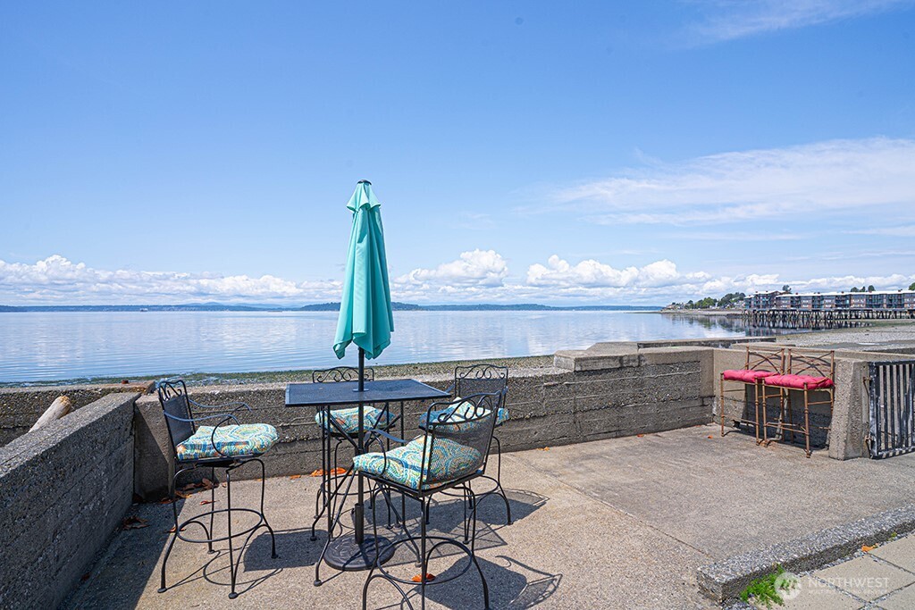 4027 Beach Drive Southwest, Unit 1 Seattle, WA 98116 - Photo 21 of 28 a view of a terrace with furniture and stove