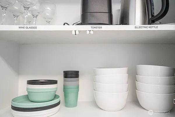 a bathroom with a toilet and a mirror