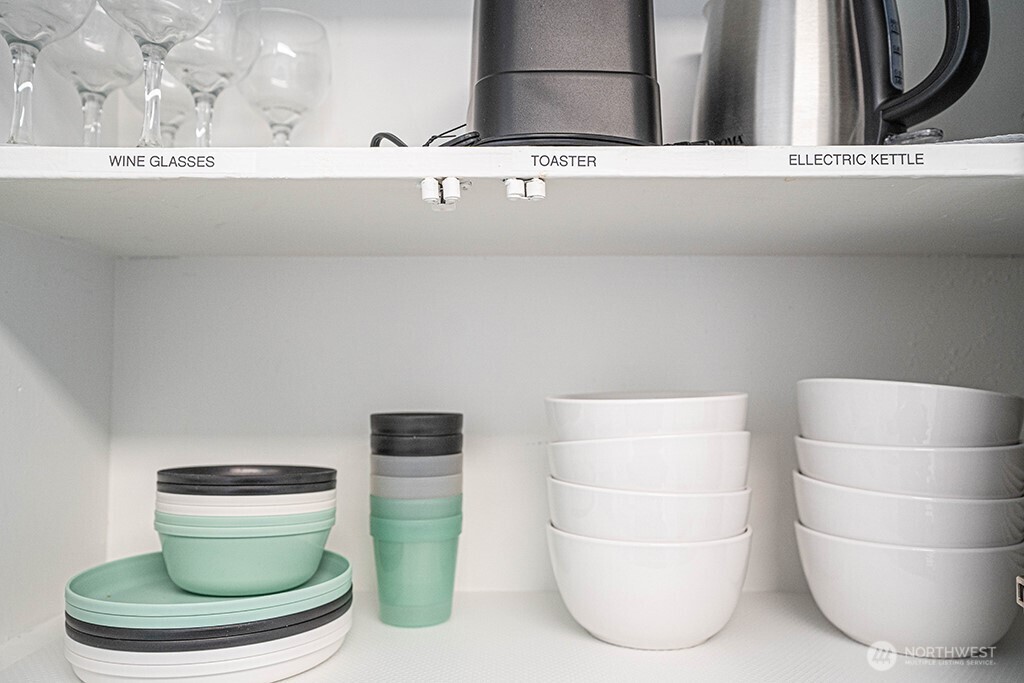 4027 Beach Drive Southwest, Unit 1 Seattle, WA 98116 - Photo 23 of 28 a bathroom with a toilet and a mirror