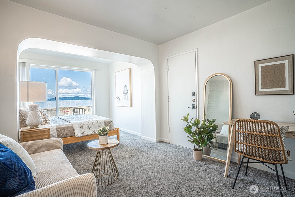 4027 Beach Drive Southwest, Unit 1 Seattle, WA 98116 - Photo 3 of 28 a living room with furniture and a potted plant