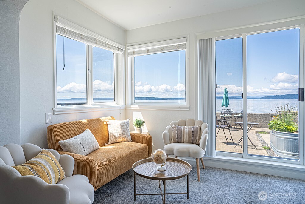 4027 Beach Drive Southwest, Unit 1 Seattle, WA 98116 - Photo 5 of 28 a living room with furniture and a large window