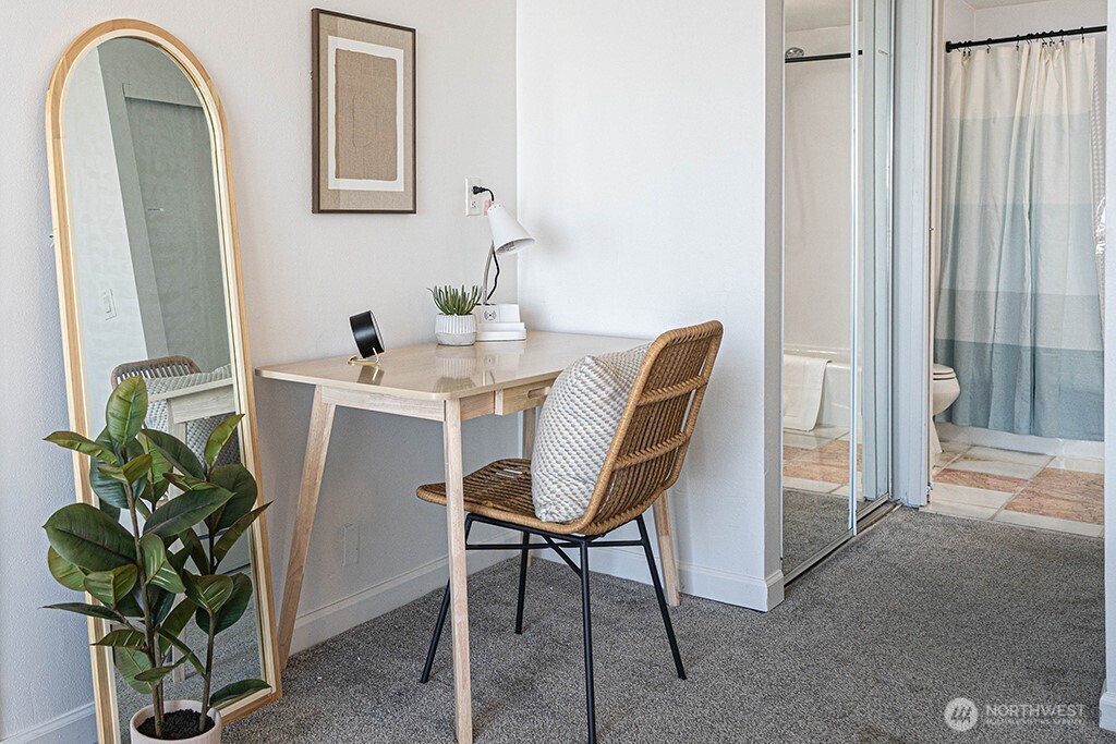 4027 Beach Drive Southwest, Unit 1 Seattle, WA 98116 - Photo 7 of 28 a dining room with furniture and potted plants