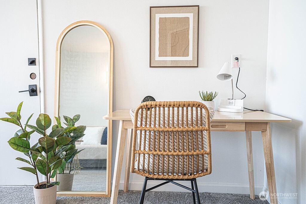 4027 Beach Drive Southwest, Unit 1 Seattle, WA 98116 - Photo 8 of 28 a view of a dining room with furniture and a potted plant