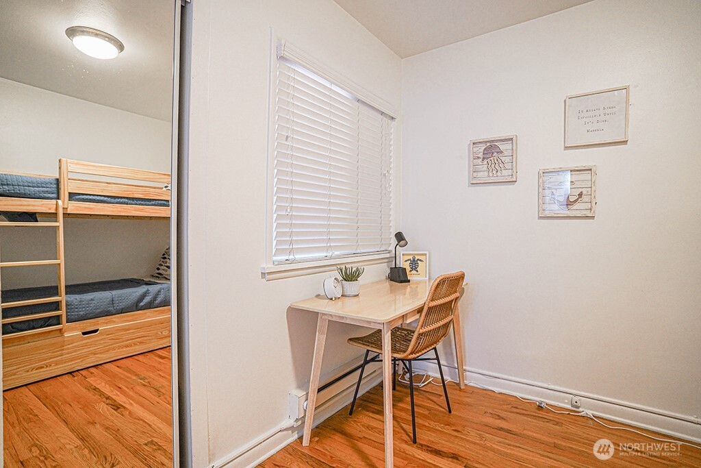 4027 Beach Drive Southwest, Unit 1 Seattle, WA 98116 - Photo 10 of 28 a view of a room that has a table and chairs in it