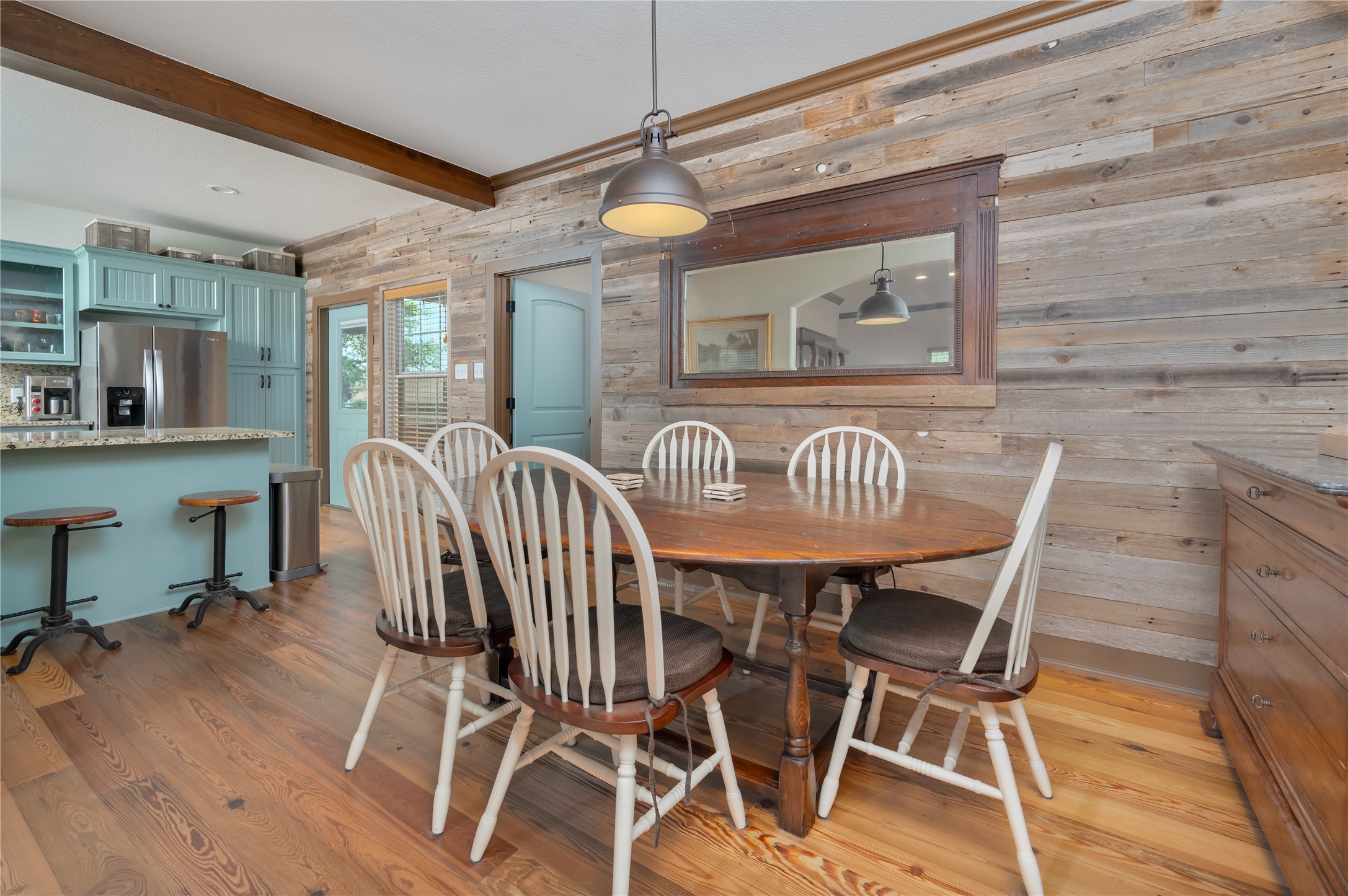 270 Dry Creek Road Manor, TX 78653 - Photo 16 of 40 Reclaimed wood accent walls add character and warmth to this charming dining space.