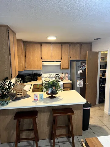 a kitchen with a sink cabinets and stainless steel appliances