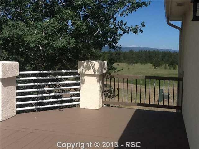 16835 Roller Coaster Road Colorado Springs, CO 80921 - Photo 14 of 25 Freshly Painted Deck off of Kitchen-Stairs can be added to walk down to Covered Patio area