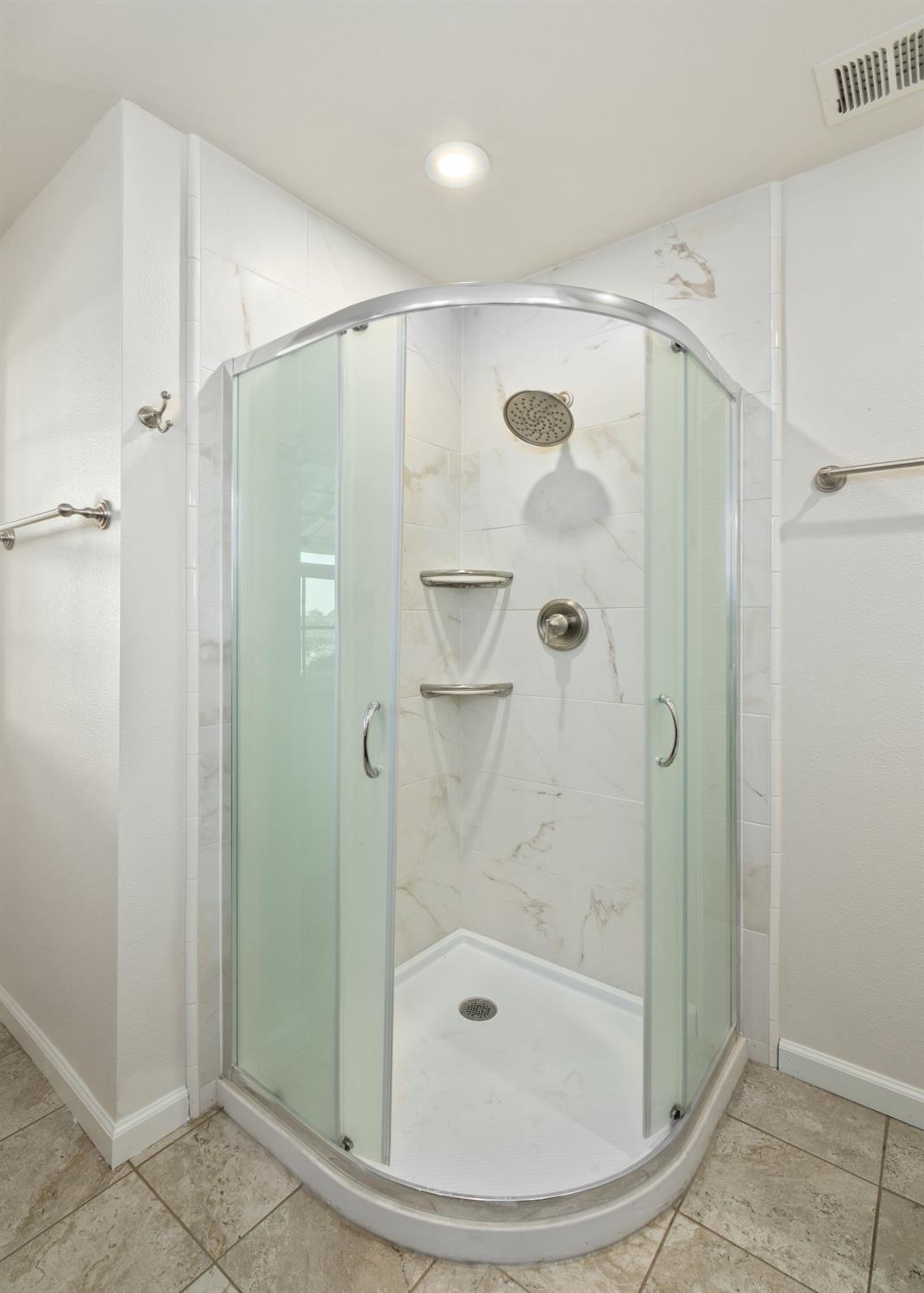 29001 Ave 22 Madera, CA 93638 - Photo 14 of 31 a bathroom with a shower and a tub