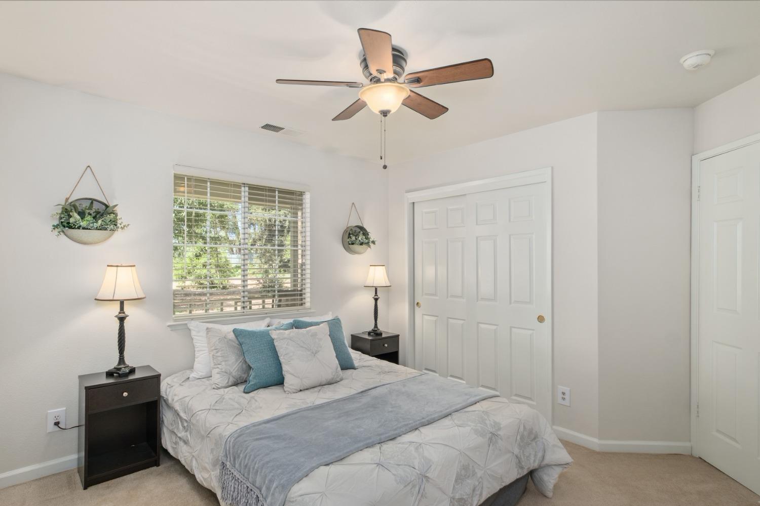 29001 Ave 22 Madera, CA 93638 - Photo 15 of 31 a bedroom with a bed and a window