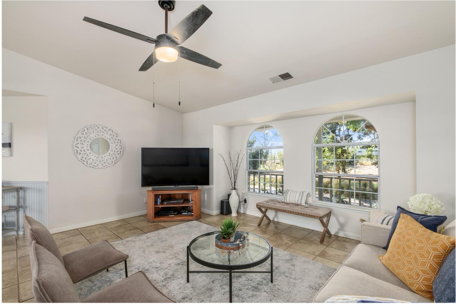 29001 Ave 22 Madera, CA 93638 - Photo 4 of 31 a living room with furniture a window and a flat screen tv