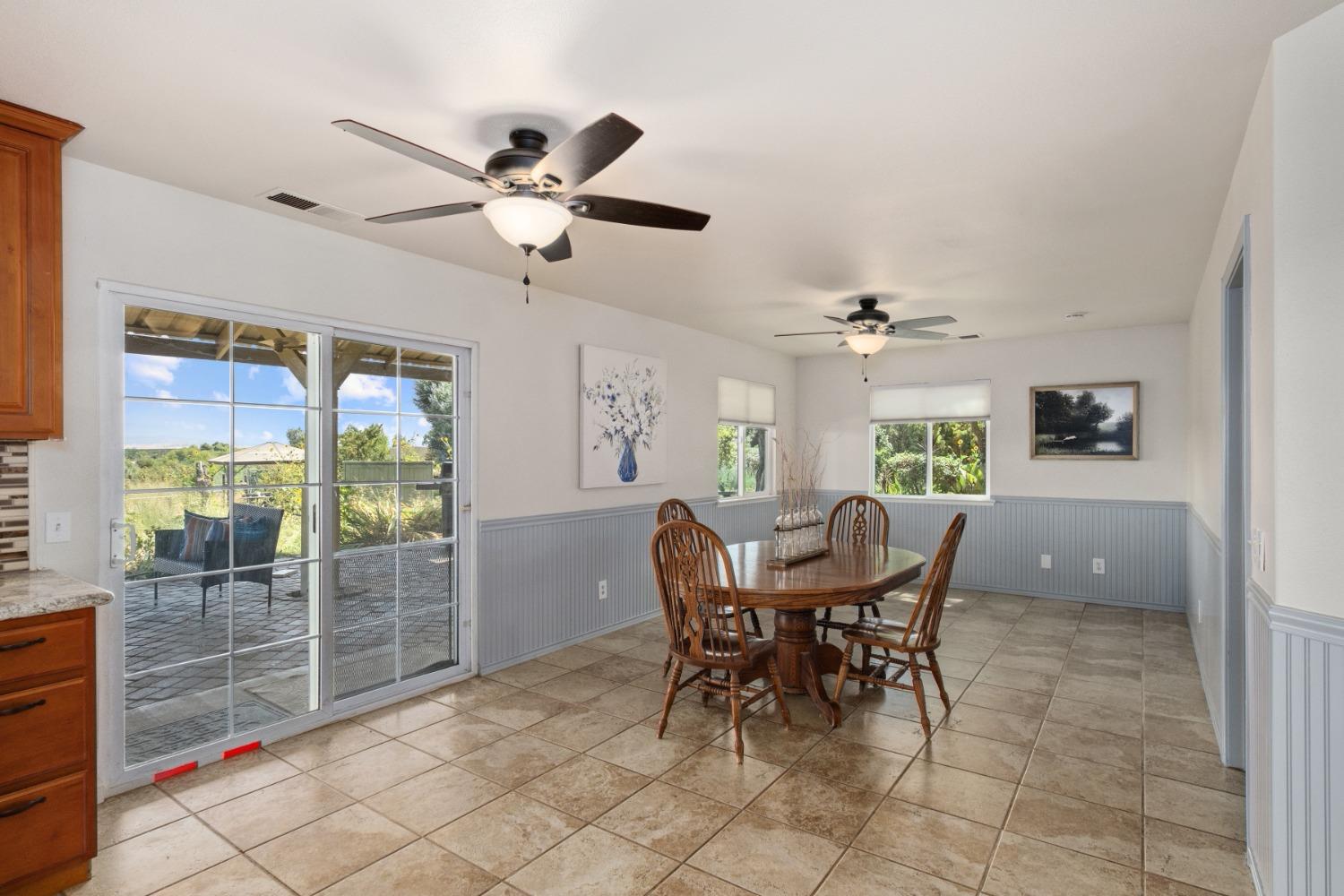 29001 Ave 22 Madera, CA 93638 - Photo 9 of 31 a view of a dining room with furniture and window