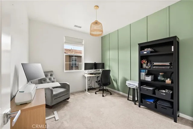 a bedroom with furniture and a window