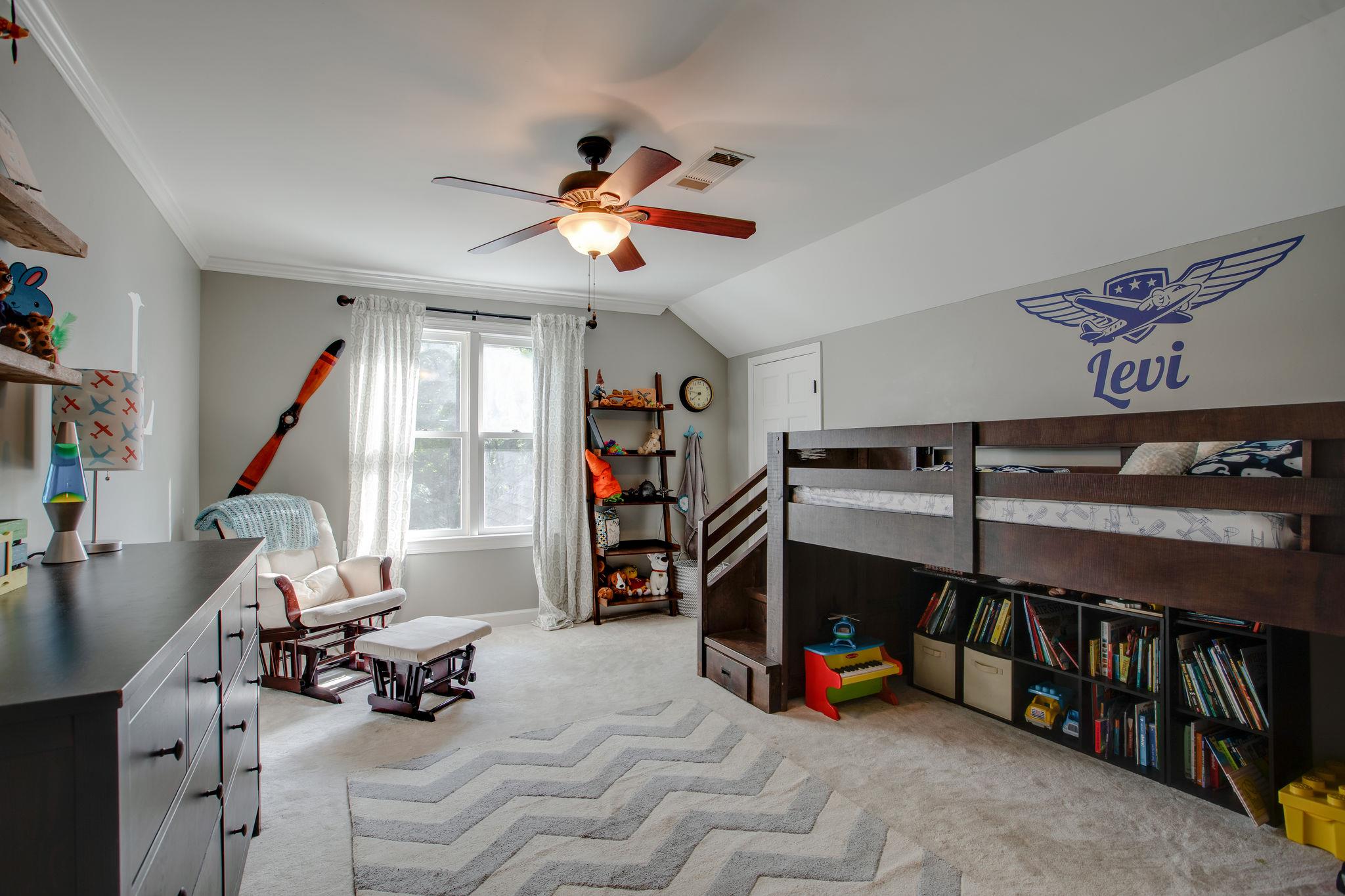 608 Rice Hill Road Nolensville, TN 37135 - Photo 18 of 30 a view of a livingroom with furniture and a gym equipment
