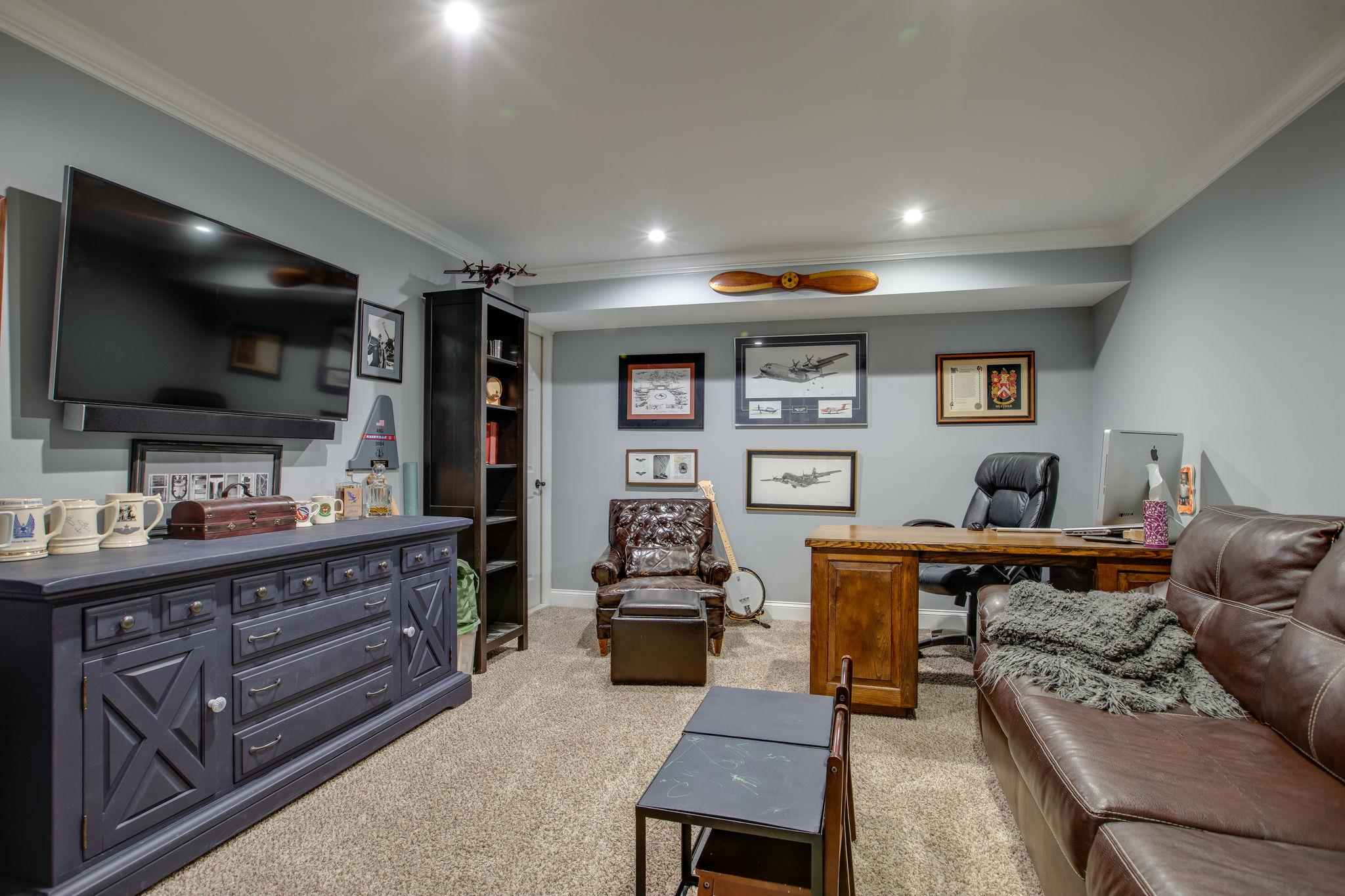 608 Rice Hill Road Nolensville, TN 37135 - Photo 21 of 30 a living room with furniture and a flat screen tv