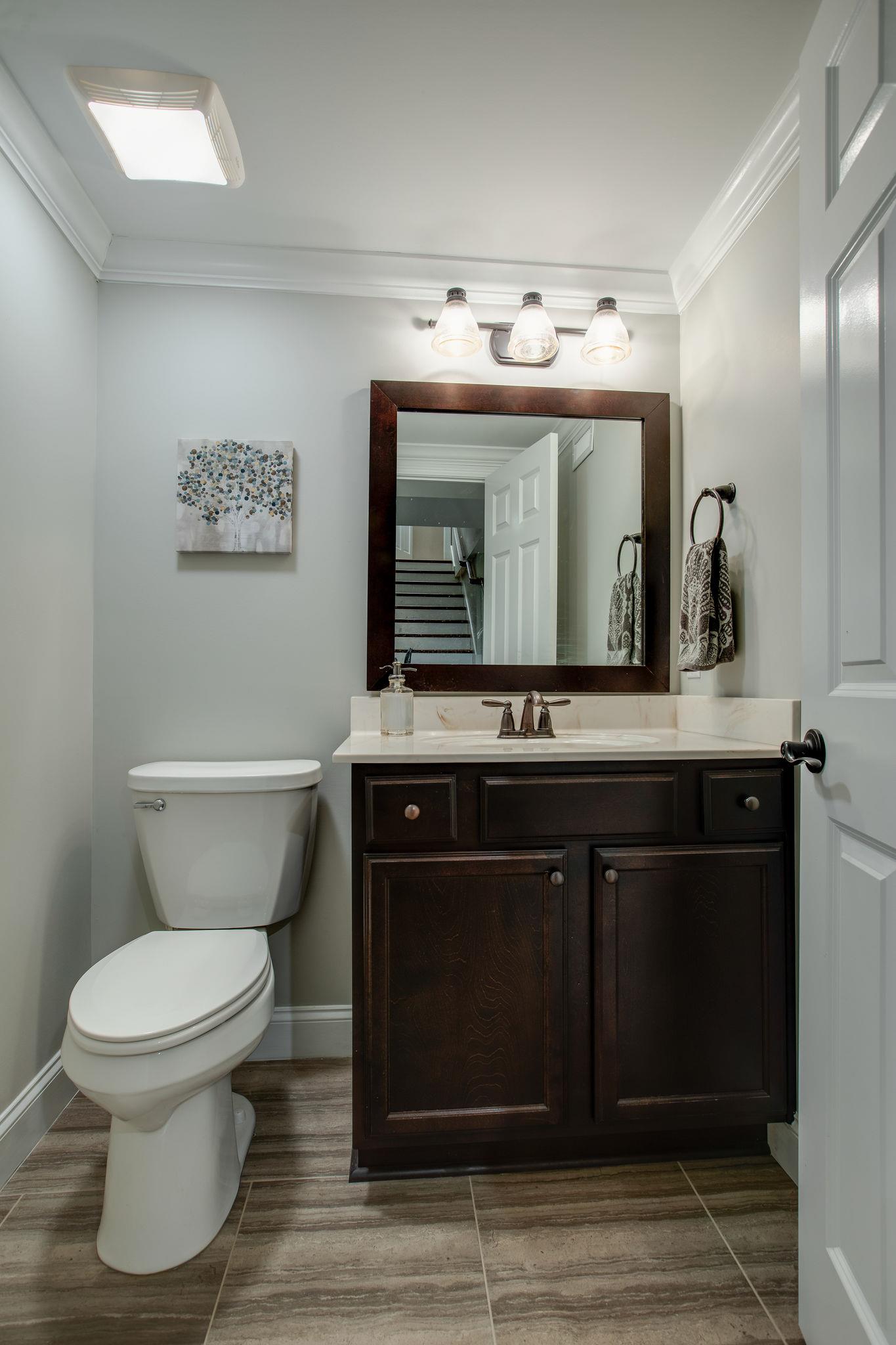 608 Rice Hill Road Nolensville, TN 37135 - Photo 22 of 30 a bathroom with a toilet sink and mirror