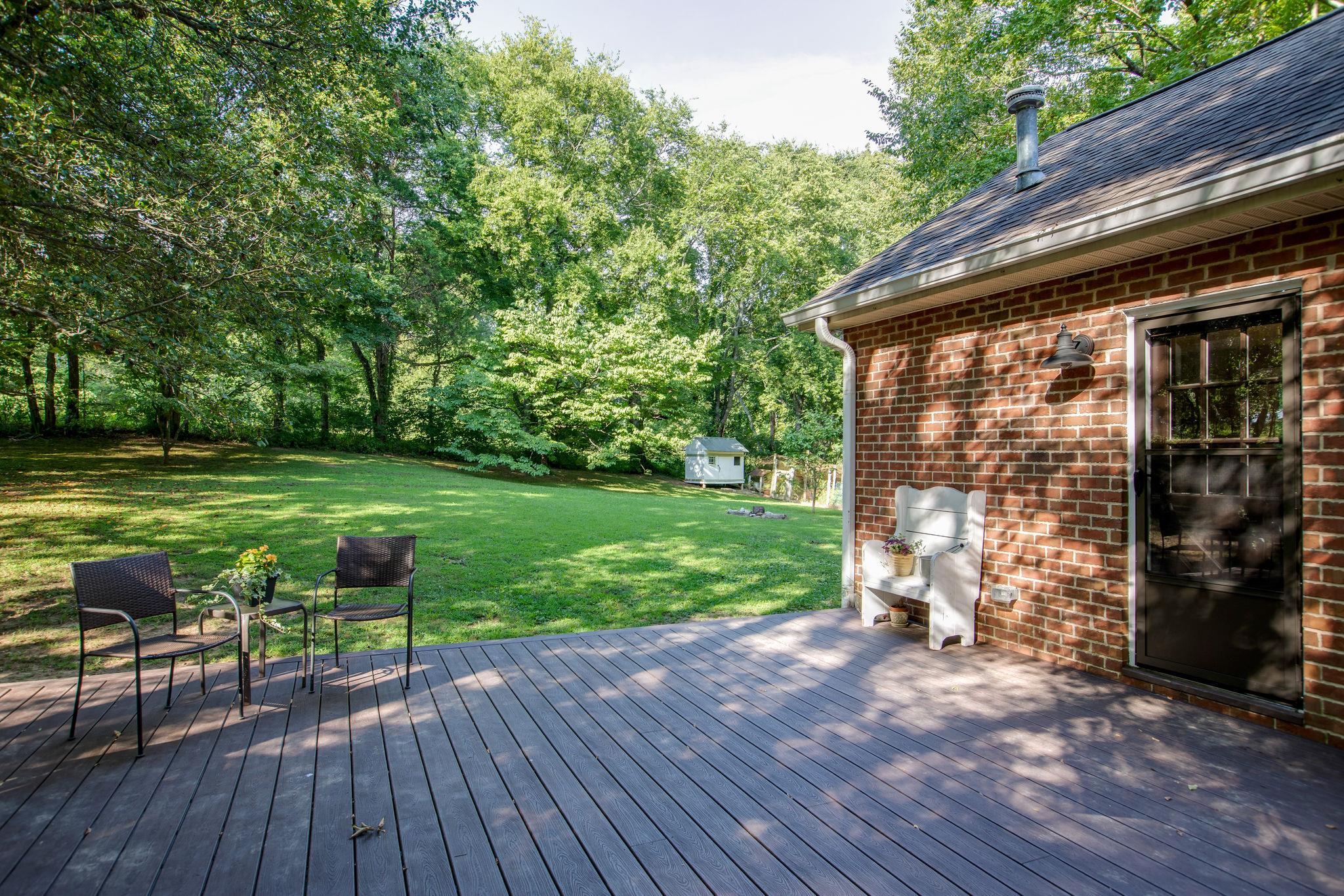 608 Rice Hill Road Nolensville, TN 37135 - Photo 25 of 30 a view of a house with backyard porch and sitting area