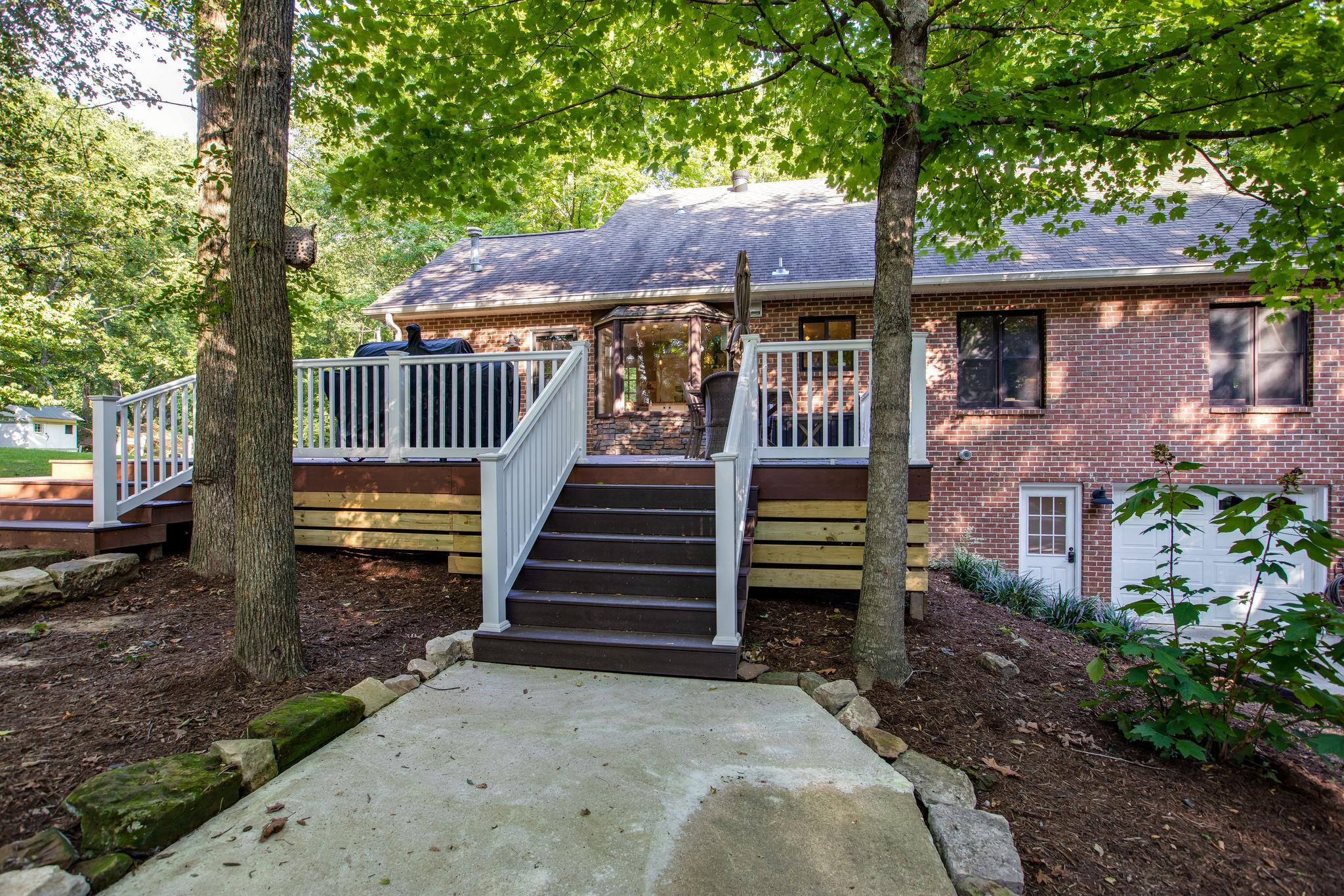 608 Rice Hill Road Nolensville, TN 37135 - Photo 26 of 30 a view of a house with a yard plants and large tree