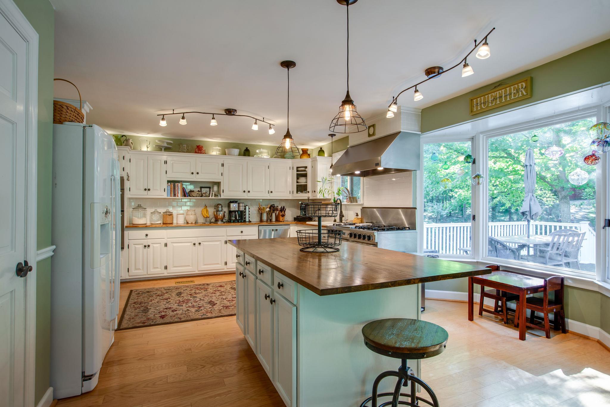 608 Rice Hill Road Nolensville, TN 37135 - Photo 8 of 30 a kitchen with stainless steel appliances granite countertop a sink a stove and a refrigerator