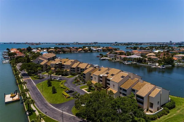 an aerial view of a house with a lake view