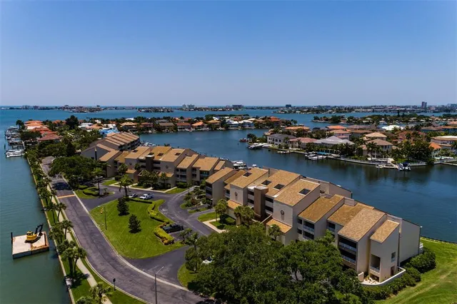 an aerial view of a house with a lake view