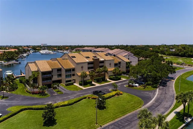 a view of a lake with houses in the back