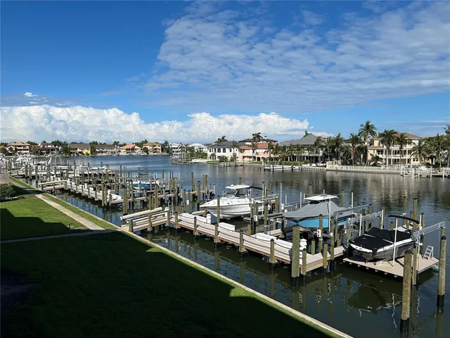 a view of a swimming pool with outdoor seating