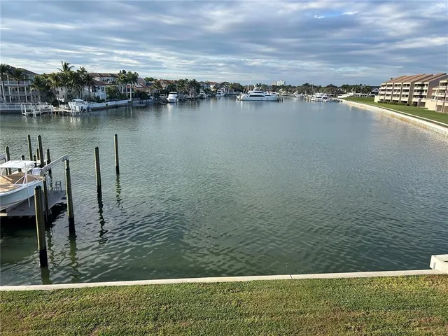 a view of a swimming pool with an outdoor seating