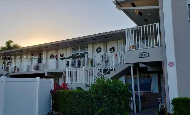 a front view of a house with balcony