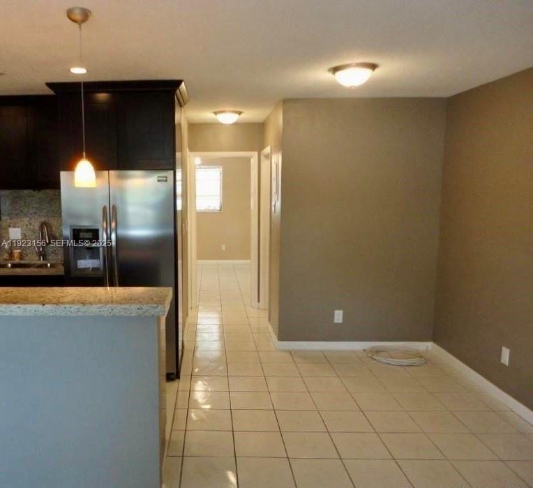 2665 Middle River Drive, Unit 7 Fort Lauderdale, FL 33306 - Photo 3 of 8 a view of a kitchen with a refrigerator and a sink