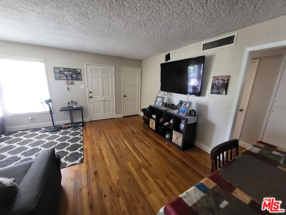 2831 Pine Street Bakersfield, CA 93301 - Photo 14 of 33 a living room with furniture and a flat screen tv