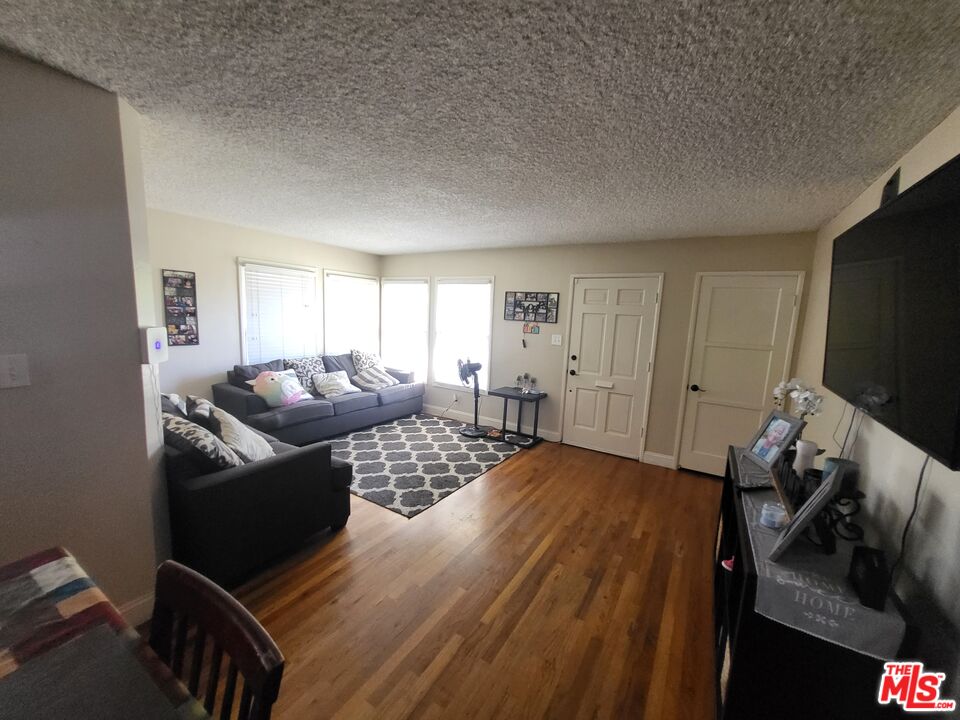 2831 Pine Street Bakersfield, CA 93301 - Photo 15 of 33 a living room with furniture and a flat screen tv