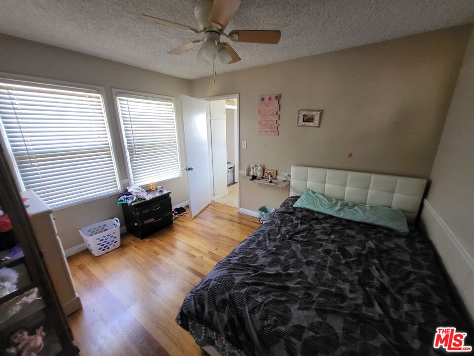 2831 Pine Street Bakersfield, CA 93301 - Photo 21 of 33 a bed sitting in a bedroom next to a window